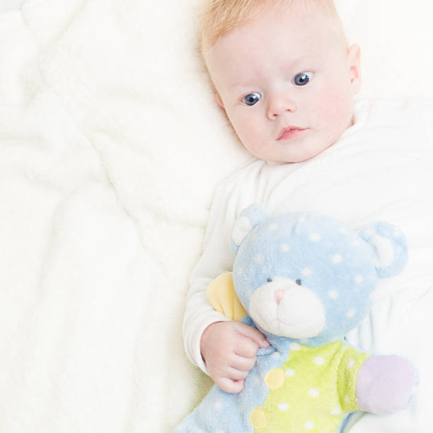 istock Baby with plush toy. 485792170
