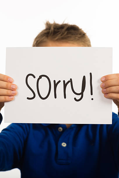 istock Child holding Sorry sign 485792272