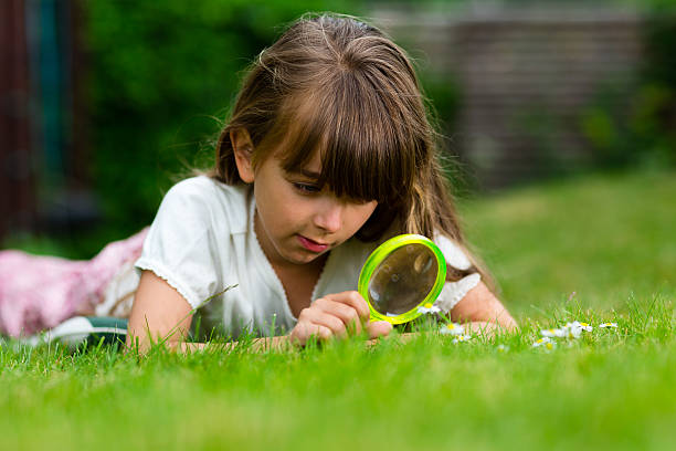 istock Girl with magnifier 485792314