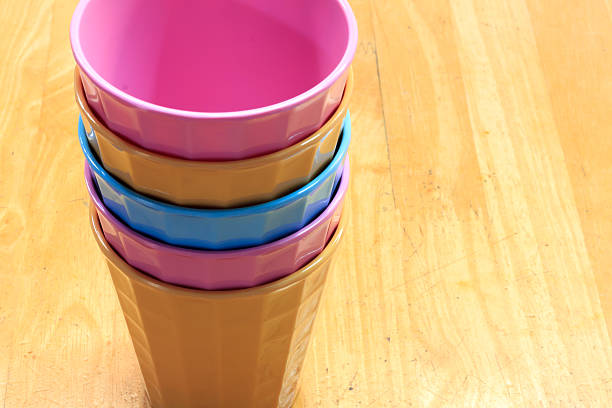 istock Colorful plastic glasses on wood background. 485792850