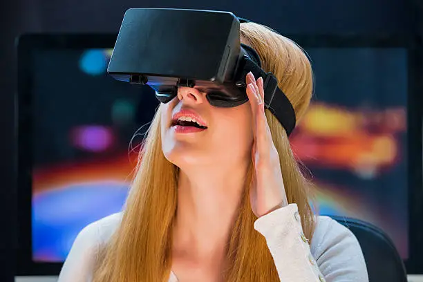 Girl with pleasure uses head-mounted display