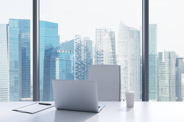 istock workplace in a modern panoramic office with Singapore view. 485793324