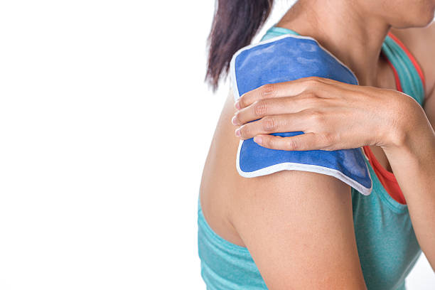 istock woman putting an ice pack on her shoulder pain 485793632