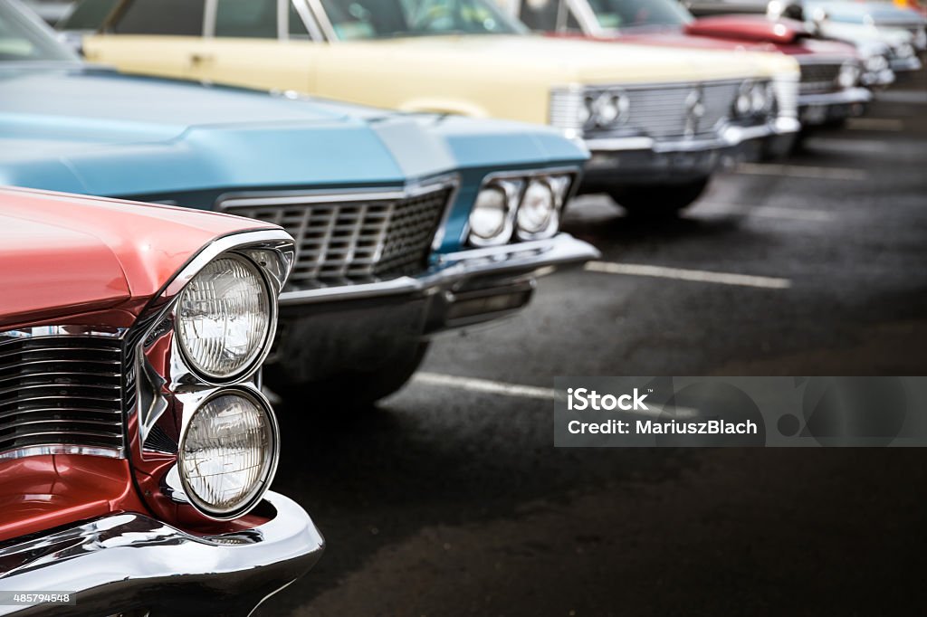 Classic cars Classic cars in a row parked on asphalt parking lot Collector's Car Stock Photo