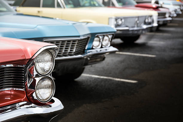 Classic cars Classic cars in a row parked on asphalt parking lot car show stock pictures, royalty-free photos & images