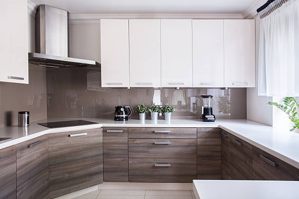 Cozy beige kitchen Cozy beige kitchen interior with wooden cupboards cupboard stock pictures, royalty-free photos & images