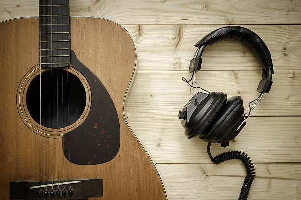 istock Old Guitar on the Wood Background 485795784