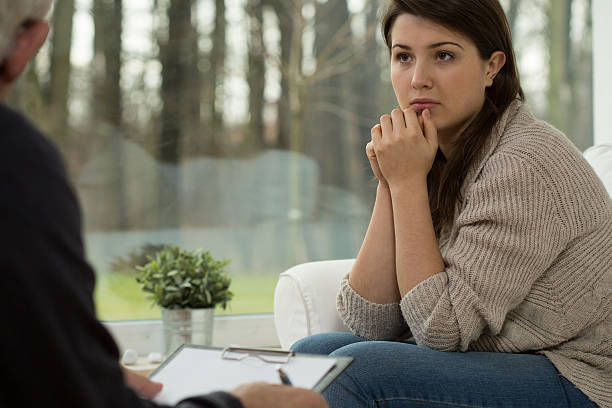 istock Young woman on psychotherapy session 485795850