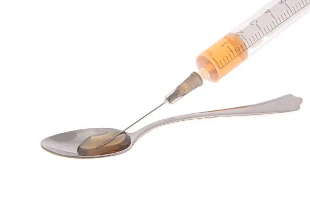 Addictions: syringe, drug. Isolated on White Background.