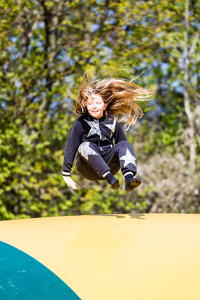 istock Happy girl on trampoline 485796770