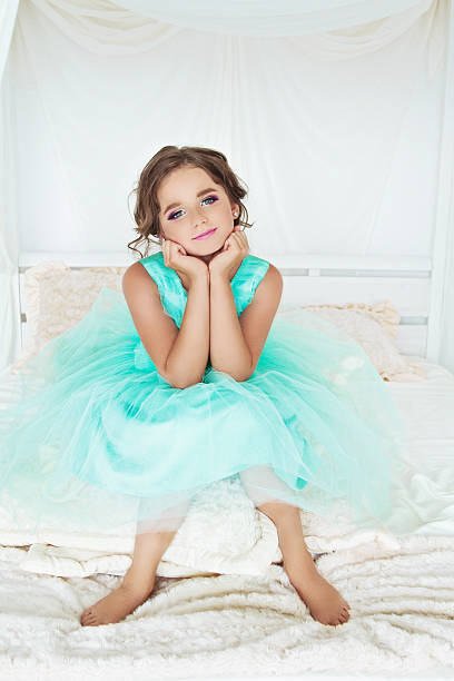istock beautiful girl on a bed 485799348