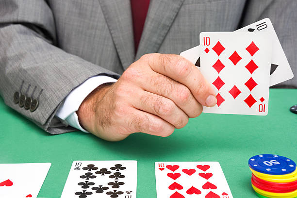 istock Man showing a poker cards 485801214