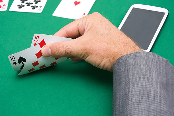 istock Man showing a poker cards 485801294