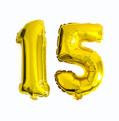 Number 15 written with foil balloons