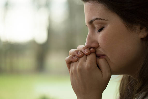 Depressed young woman crying stock photo