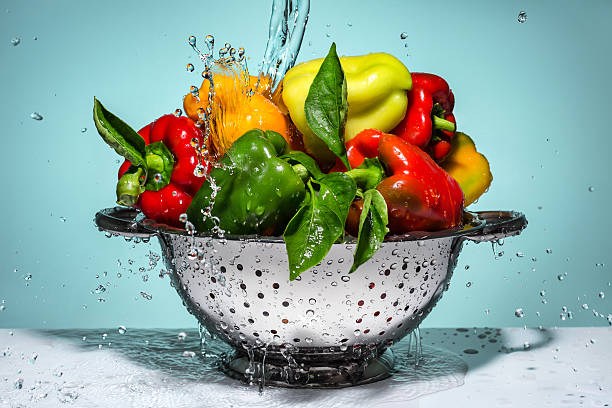 istock Peppers of different colors in a colander. 485809436