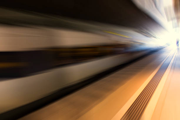 istock fast train traveling at high speed through a station 485811420