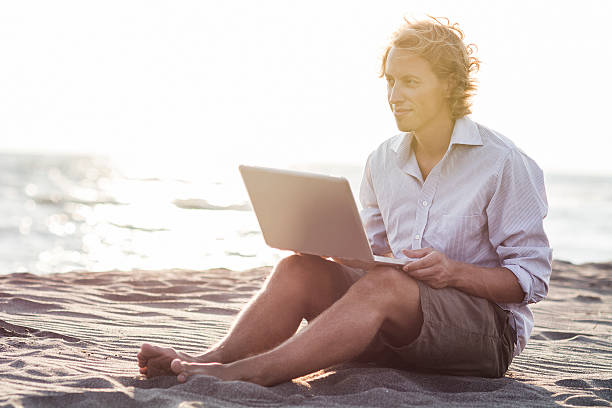 istock Young businessman on the beach 485811452