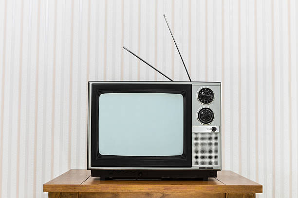 istock Old Television with Antenna on Wood Table 485811614