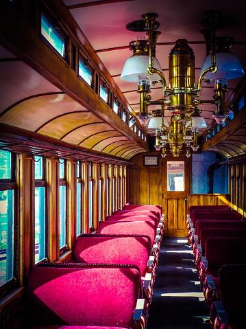 An antique railroad passenger car decorated beautifully