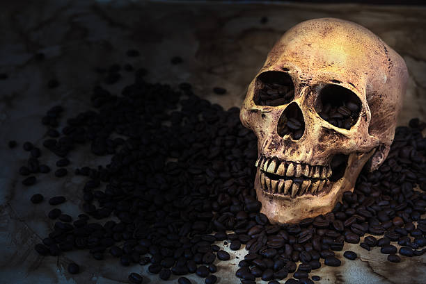 istock skull coffee bean on old paper background 485814458