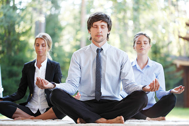 istock business people doing yoga 485815248