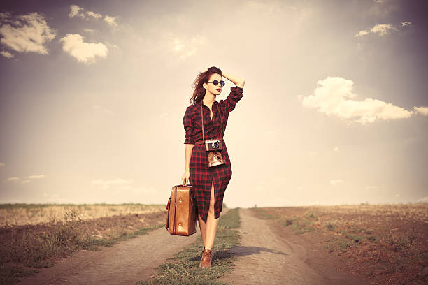 istock girl with bag and retro camera 485815324