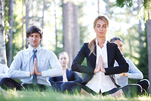 istock business people doing yoga 485815760