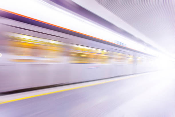 istock fast train traveling at high speed through a station 485816408