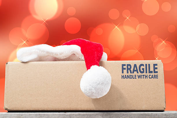 istock Season's Greetings with a Christmas purchase in a brown box 485817404