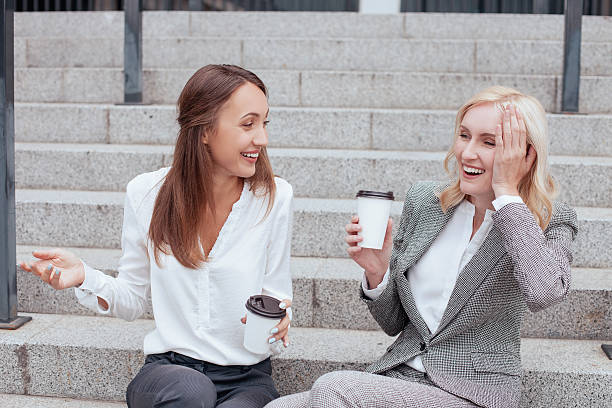 istock Beautiful young female colleagues are communicating with joy 485817948