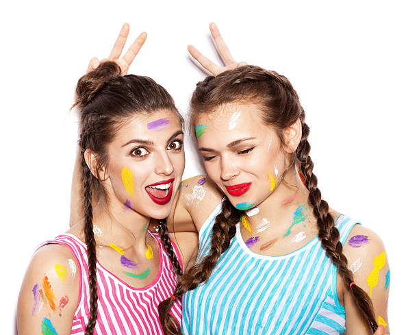 istock Two lovely painted girl friends having fun 485818988