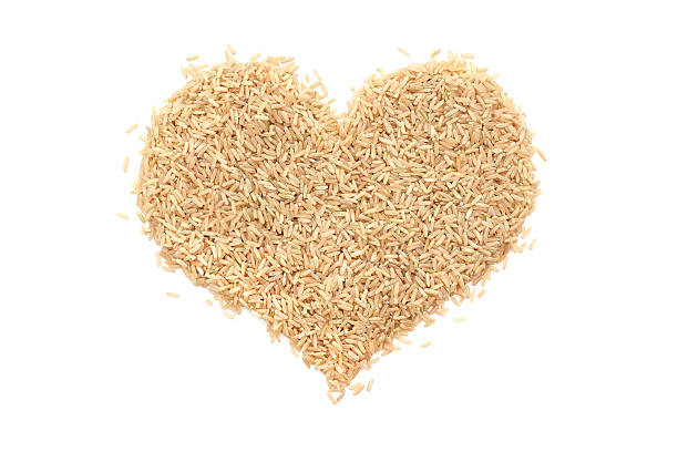 istock Long grain brown rice in a heart shape 485819186