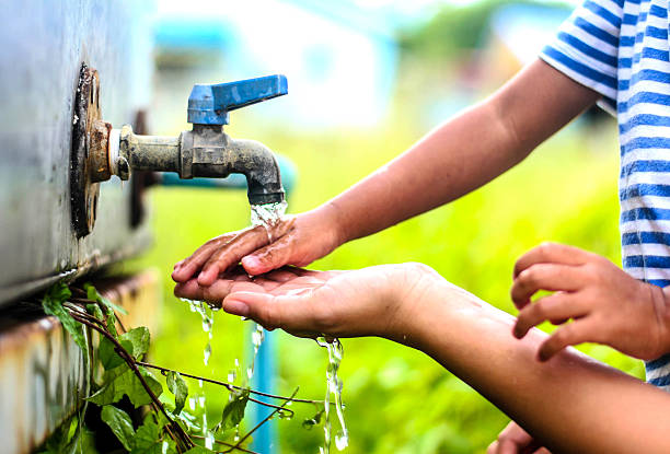 istock kid washing hands with mother, selective focus point. 485819312