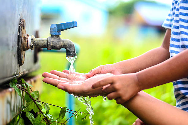 istock kid washing hands with mother, selective focus point. 485819394