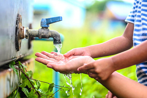 istock kid washing hands with mother, selective focus point. 485819496