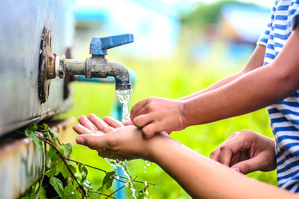 istock kid washing hands with mother, selective focus point. 485819590