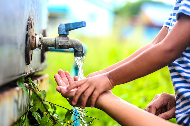 istock kid washing hands with mother, selective focus point. 485819650