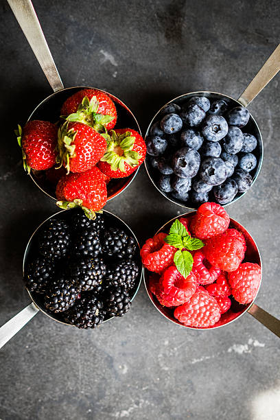 istock Mix of fresh berries on rustic background 485819834