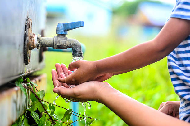 istock kid washing hands with mother, selective focus point. 485819984