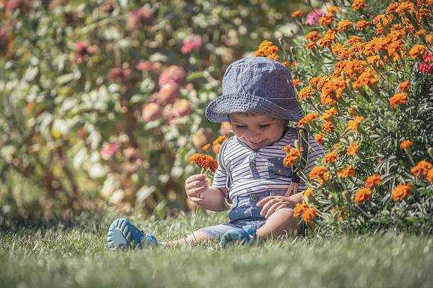 istock baby boy in flowers 485820056