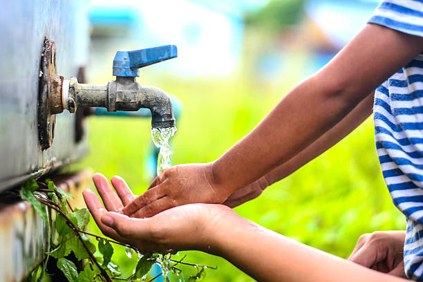 istock kid washing hands with mother, selective focus point. 485820072