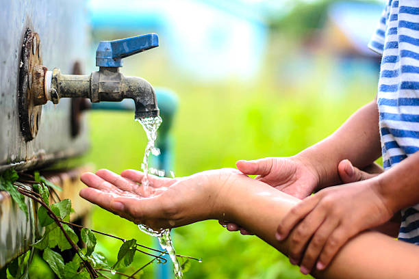 istock kid washing hands with mother, selective focus point. 485820142