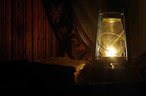 istock Book, oil lamp and mirror in the dark 485820624
