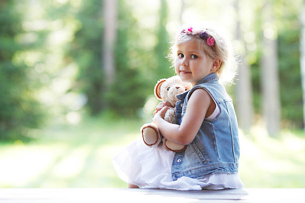 istock young girl with teddybear 485820926