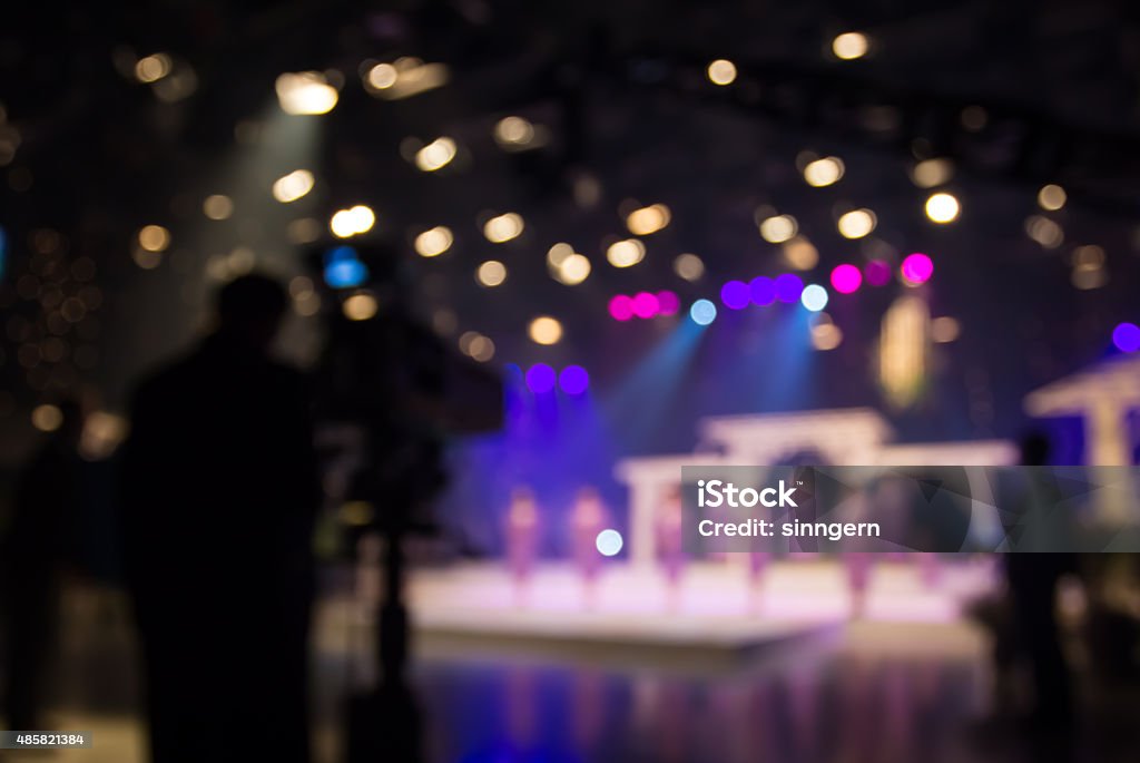 Actress or singer in studio of television station with camera Television Set Stock Photo