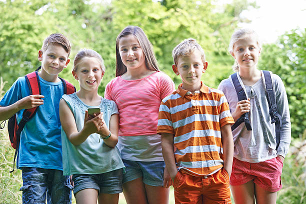 istock Group Of Children Geocaching In Woods 485821420
