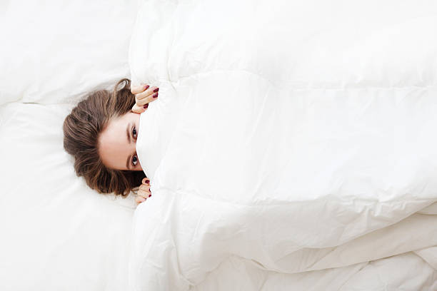 istock woman in bed under the blanket 485821790