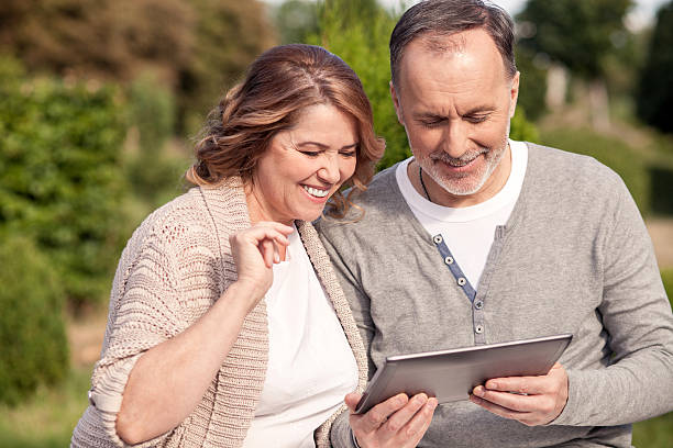 istock Pretty mature family is using a laptop for fun 485822400