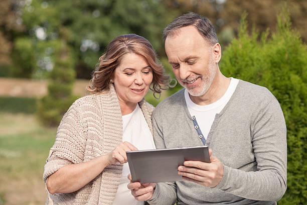 istock Pretty old husband and wife are using a tablet 485823400